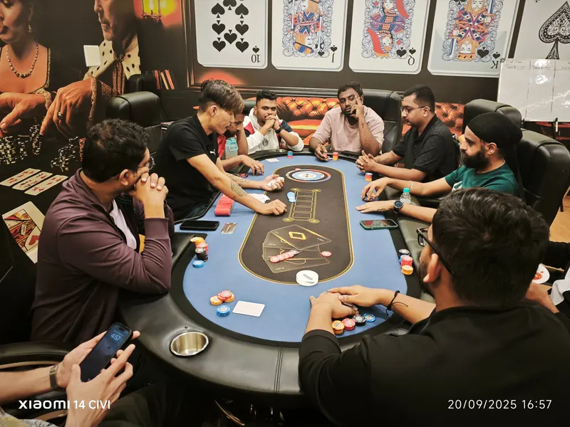Players at a live poker table inside Kings & Queens Poker Club Bangalore
